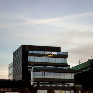 Contemporary architecture showcasing Amazon office at dusk in Iași, Romania.