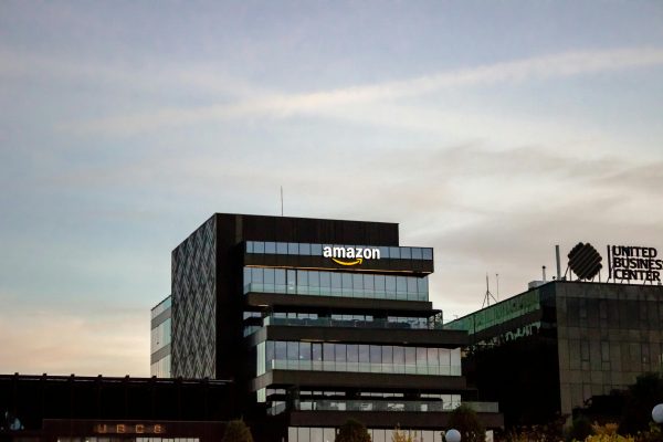 Contemporary architecture showcasing Amazon office at dusk in Iași, Romania.